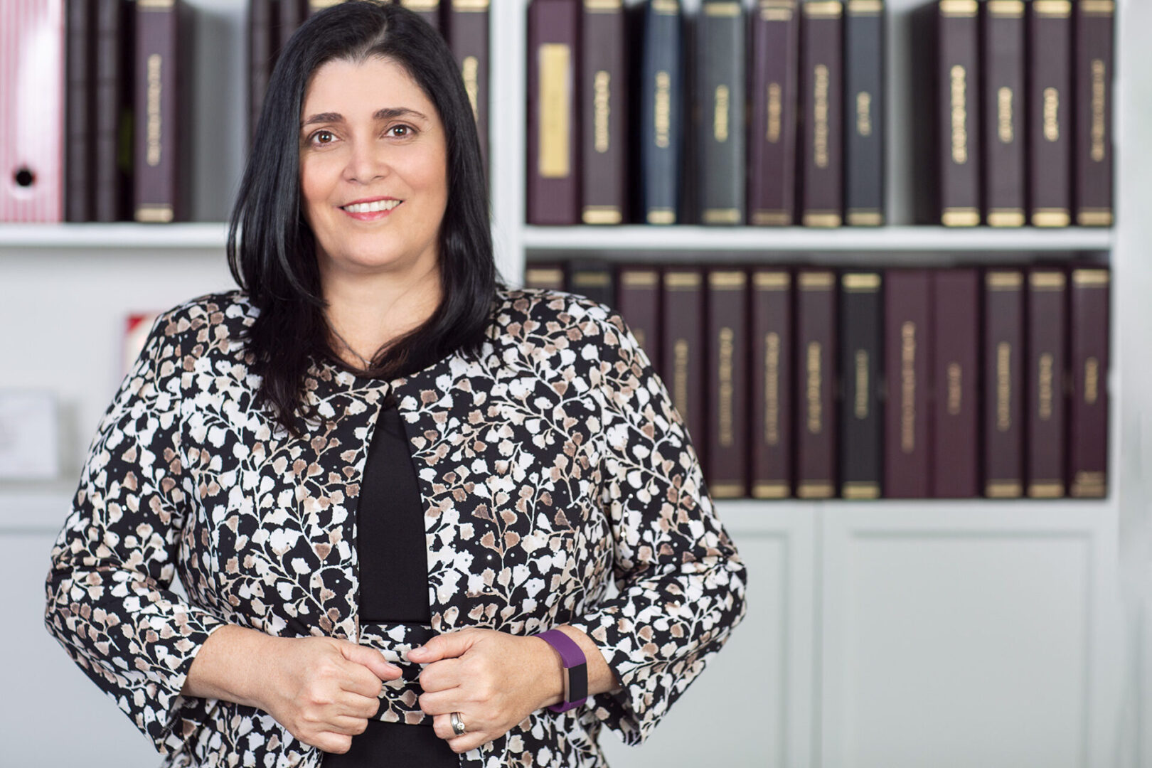 A woman in a black and white floral shirt